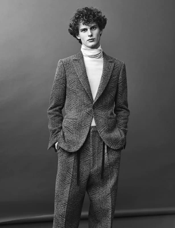 Black and white portrait in a tweed suit